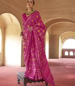 Hot pink poly viscose silk patola printed saree with heavy dimond swarovski work border