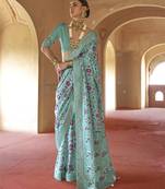 Turquoise poly viscose silk patola printed saree with heavy dimond swarovski work border