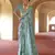 Turquoise poly viscose silk patola printed saree with heavy dimond swarovski work border