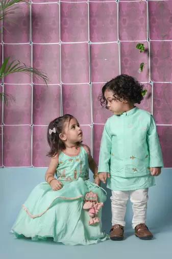 Mint green travel theme hand embroidered blouse with double layer ghagara set