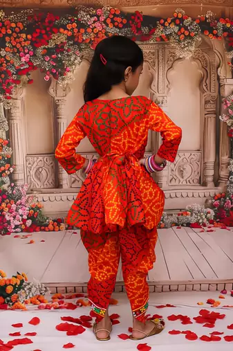 Orange printed cotton kurti with dhoti set for girls