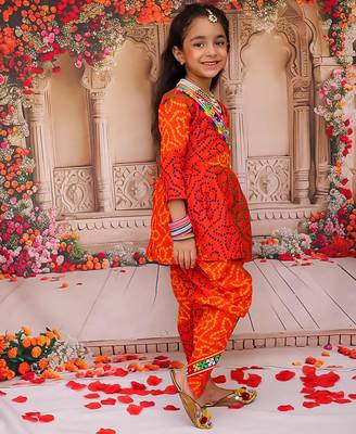 Orange printed cotton kurti with dhoti set for girls 3