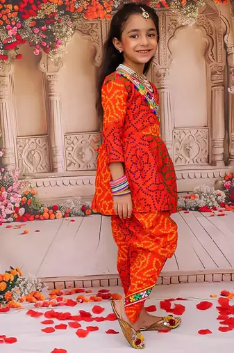 Orange printed cotton kurti with dhoti set for girls