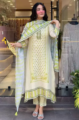 off white colored party wear embroidered stitched linen silk pant style kurti suit with duppatta