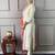 off white colored party wear embroidered stitched chanderi silk pant style kurti suit with duppatta