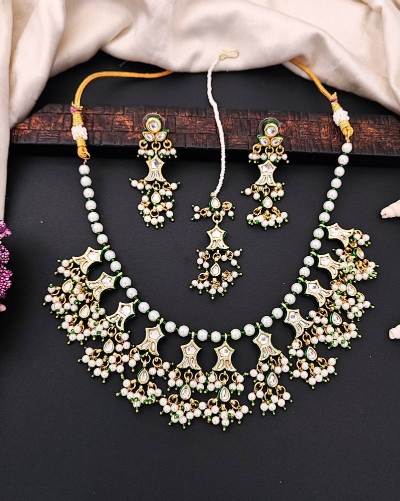 Beautiful kundan pearl and green pearls necklace set with maang tikka & earrings