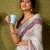 Off-white and mauve linen zari screen printed zari work ceremony and festival ready to wear saree with blouse