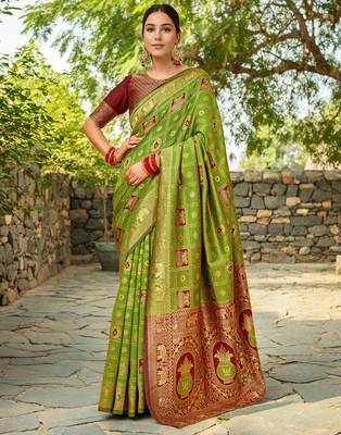 Light green paithani silk blend saree with intricate hand woven and unstitched blouse 1