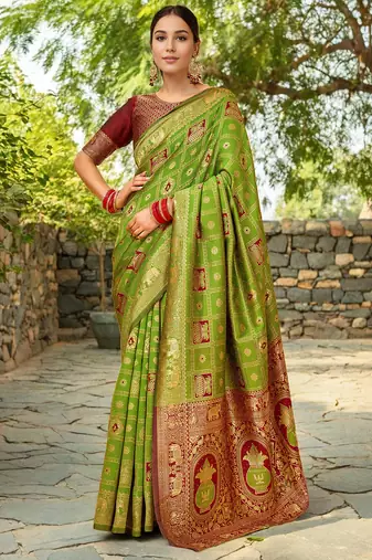 Light green paithani silk blend saree with intricate hand woven and unstitched blouse