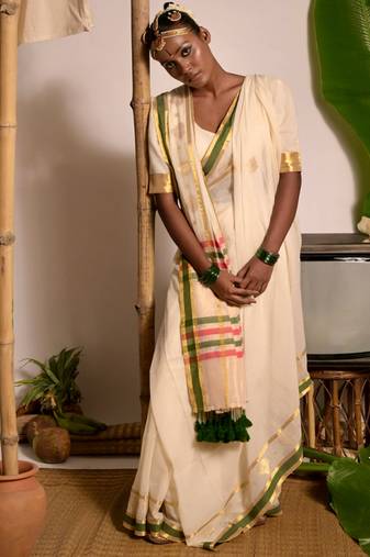 off white handwoven mul cotton saree with green and zari border