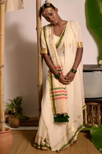 off white handwoven mul cotton saree with green and zari border