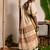 off white handwoven mul cotton saree with green and zari border
