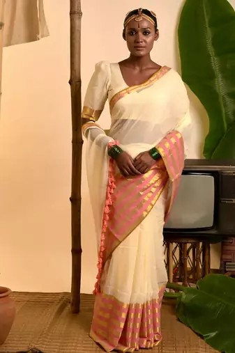 cream white cotton saree with pink and golden striped border