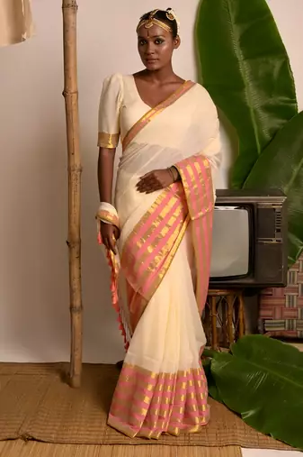 cream white cotton saree with pink and golden striped border