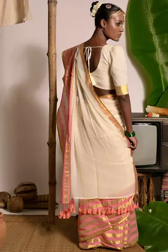 cream white cotton saree with pink and golden striped border