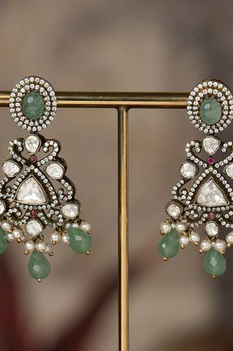 Gold plated green beads jhumkas in sterling silver