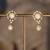Gold plated polki jhumkas in sterling silver