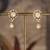 Gold plated polki jhumkas in sterling silver