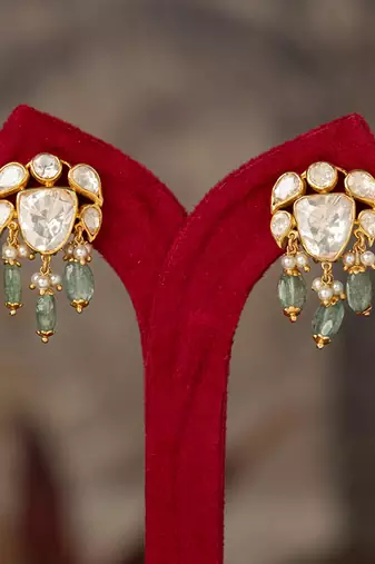 Gold plated green polki jhumkas in sterling silver