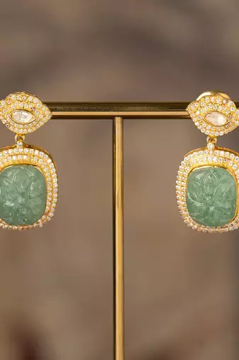 Gold plated green stone polki jhumkas in sterling silver