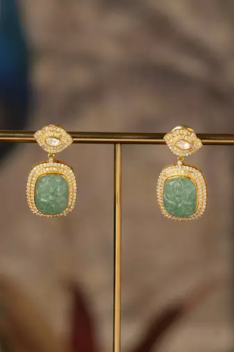 Gold plated green stone polki jhumkas in sterling silver