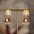 Gold plated red stone polki jhumkas in sterling silver