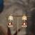 Gold plated red stone polki jhumkas in sterling silver