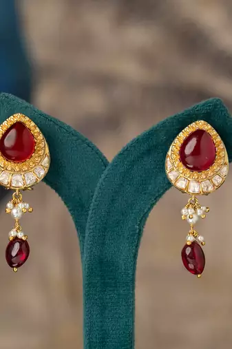 Gold plated red stone polki jhumkas in sterling silver