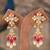 Gold plated pink beads jhumkas in sterling silver