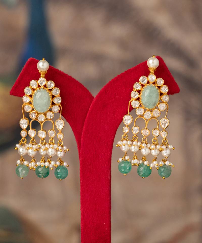 Gold plated green stone jhumkas in sterling silver
