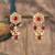 Gold plated red beads jhumkas in sterling silver