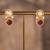 Gold plated red stone jhumkas in sterling silver