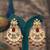 Gold plated red stone jhumkas in sterling silver