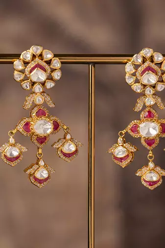Gold plated red stone jhumkas in sterling silver