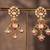 Gold plated red stone jhumkas in sterling silver