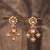 Gold plated red stone jhumkas in sterling silver