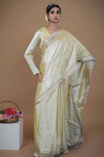 neon yellow handwoven tissue saree with matte gold lace