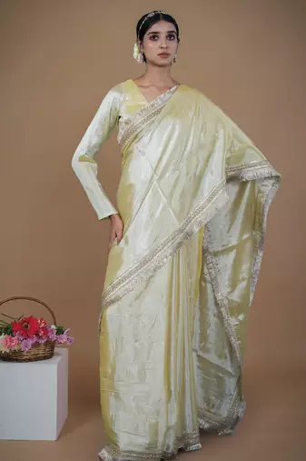 neon yellow handwoven tissue saree with matte gold lace