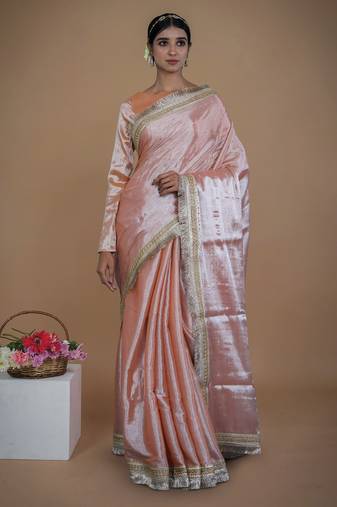 neon orange handwoven tissue saree with matte gold lace