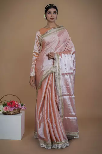 neon orange handwoven tissue saree with matte gold lace