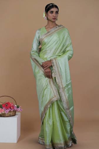 green handwoven tissue saree with matte gold lace