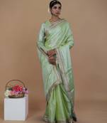 green handwoven tissue saree with matte gold lace