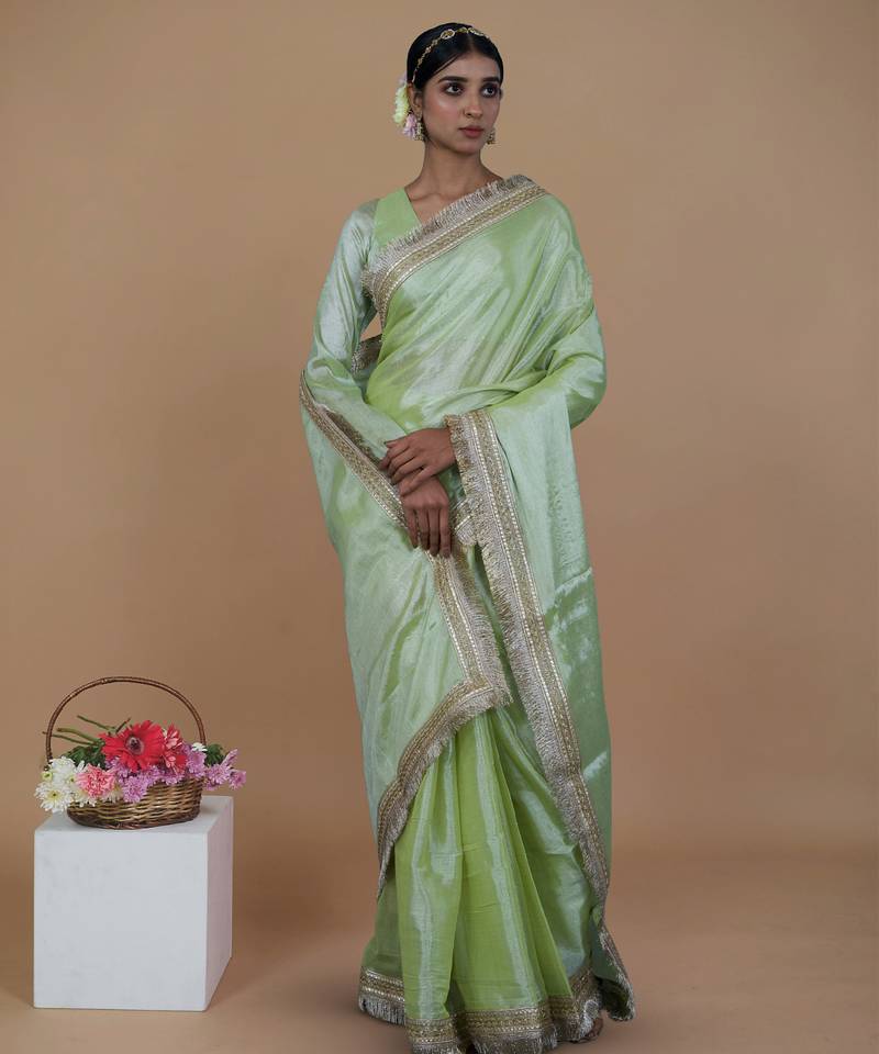 green handwoven tissue saree with matte gold lace