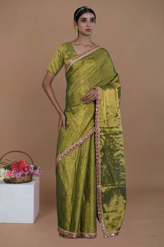 green handwoven tissue saree with scalloped lace