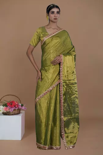 green handwoven tissue saree with scalloped lace