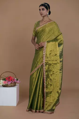 green handwoven tissue saree with scalloped lace