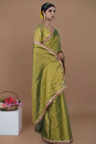 green handwoven tissue saree with scalloped lace