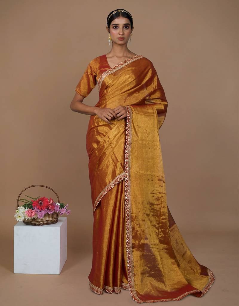 red handwoven tissue saree with scalloped lace