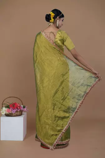 green handwoven tissue saree with scalloped lace