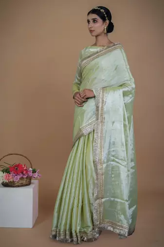 olive handwoven tissue saree with matte gold lace